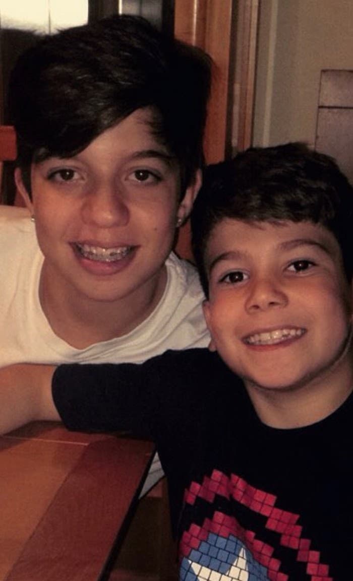 Ryan and his brother goofing around on the bunk beds