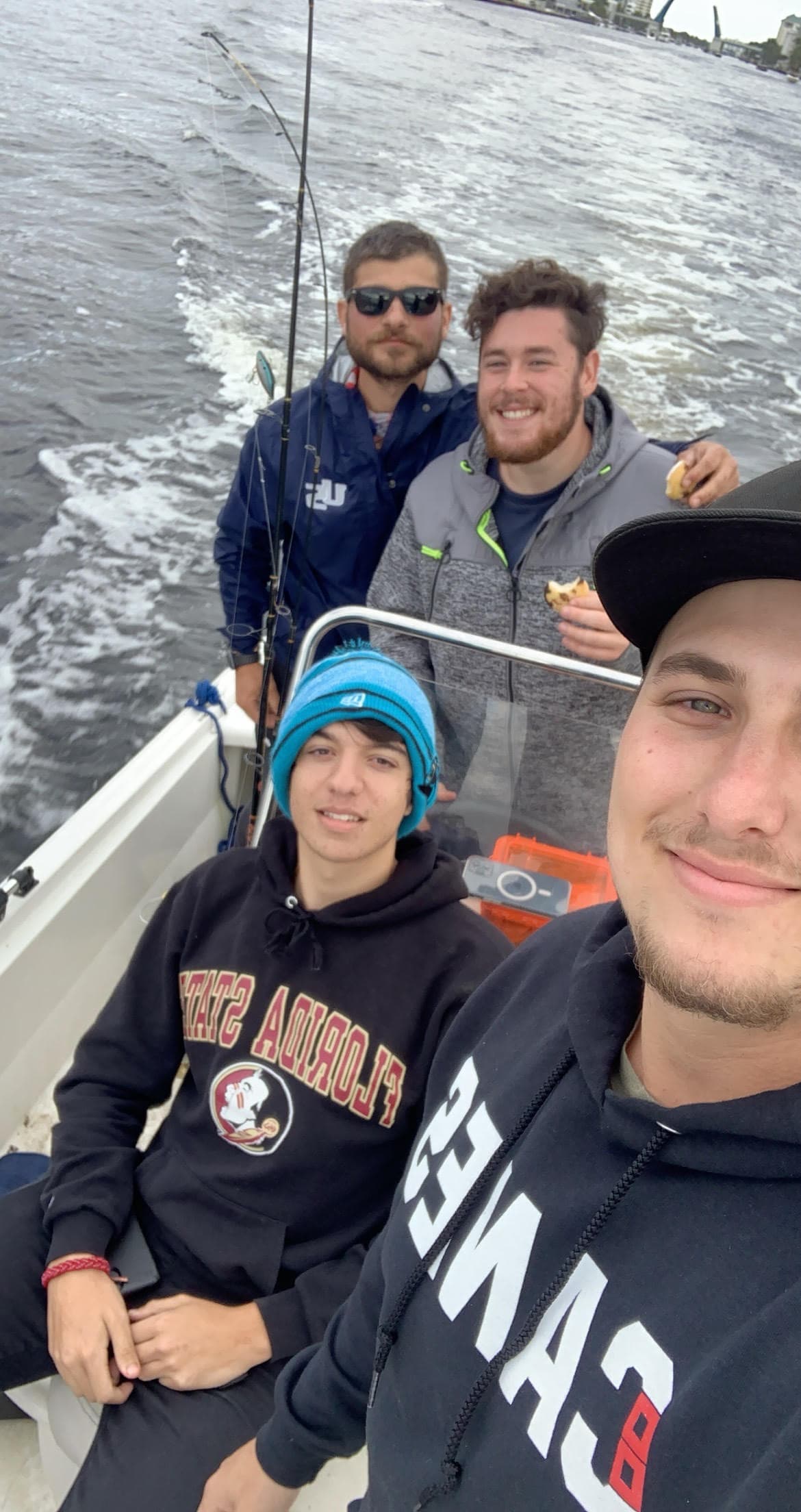 Ryan and friends fishing on a boat