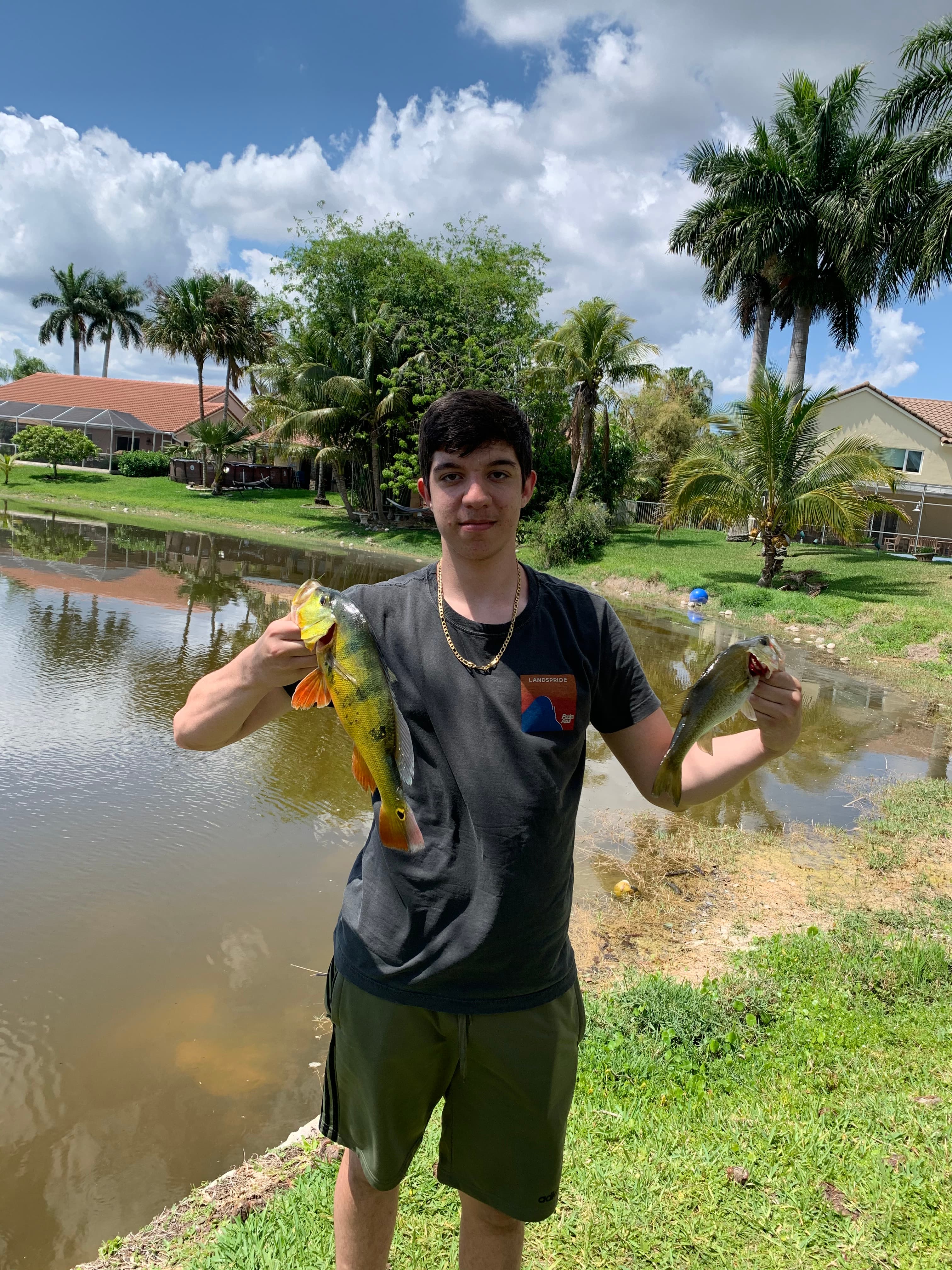 Ryan holding a peacock bass he caught
